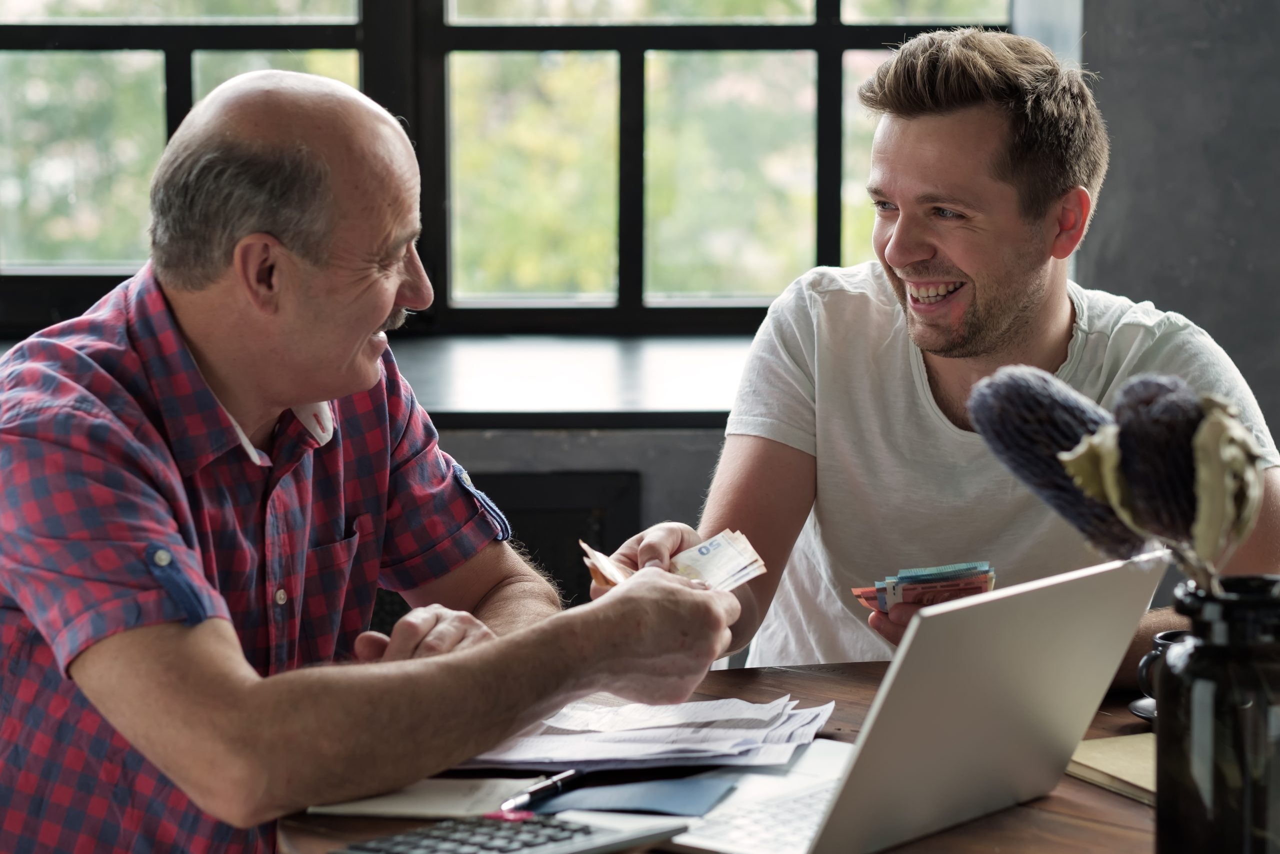 Elderly,Father,Lends,Money,To,His,Adult,Son.,He,Helps